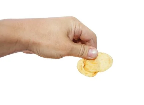 Potato chips in hand on white background Stock Photos