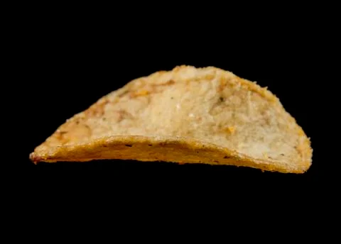 Potato chips isolated on a black background Stock Photos