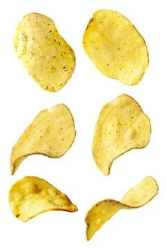 Potato chips isolated on an isolated white background. Levitating crisps. Stock Photos