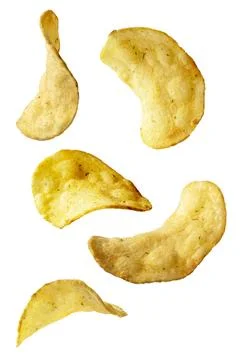 Potato chips isolated on an isolated white background. Levitating crisps. Stock Photos