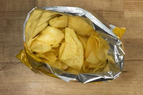 Potato chips in an open bag Stock Photos