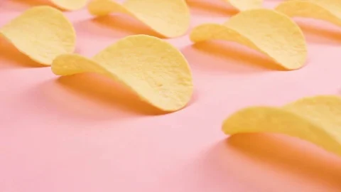 Potato chips on pastel pink background in minimalism style. Stock Footage 84988086