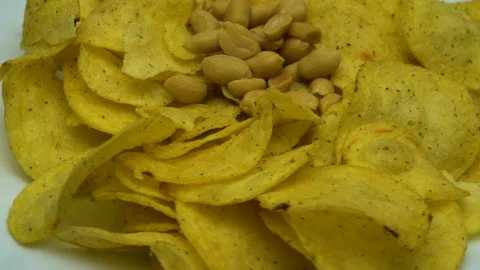 Potato chips with peanut rotating close up. Stock Footage 86575040