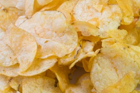 Potato chips on a plate background Stock Photos