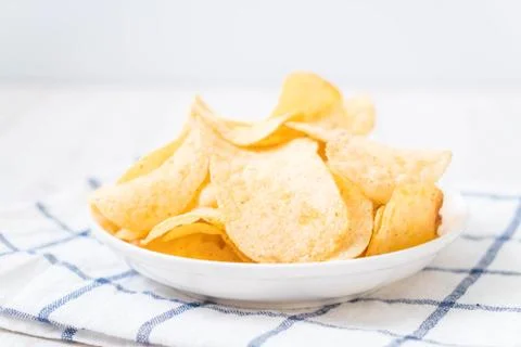 Potato chips on plate Stock Photos