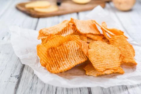 Potato Chips (rippled, selective focus) Stock Photos