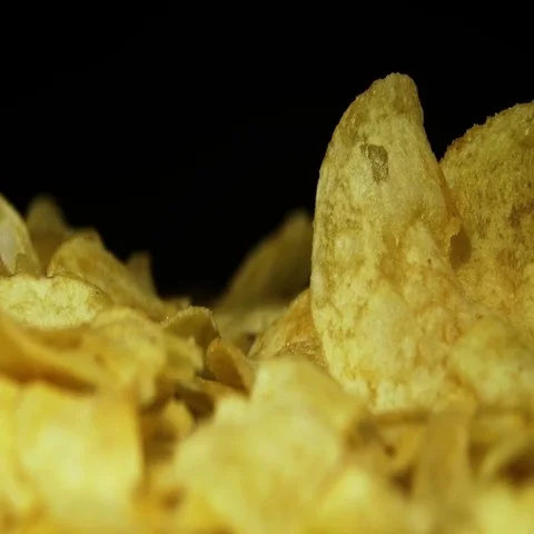 Potato Chips Rotating On Black Background Stock Footage 69734914