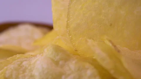 Potato Chips Rotating With Focus on Curved Edges and Thickness Stock Footage 345426512
