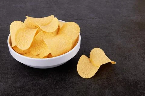 Potato chips in a saucer Stock Photos