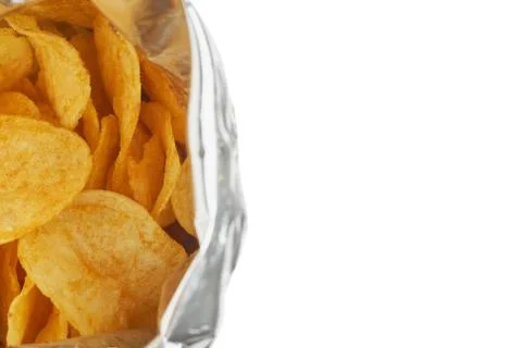 Potato chips in a silver package isolated on a white background close-up. Stock Photos