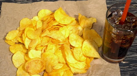 Potato chips with soda and remote control Video stock 68908765