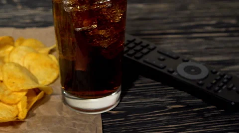 Potato chips with soda and remote control Stock-Footage 69028011