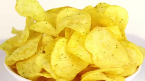 Potato chips spin in a circle on a light background 스톡 동영상 229561433