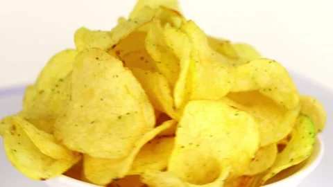 Potato chips spin in a circle on a light background Stock-Footage 232032897