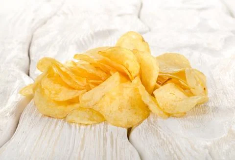 Potato chips on a table Stock Photos