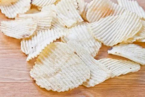 Potato chips on table Stock Photos