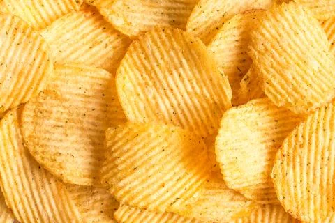 Potato chips texture background. Potatoes pattern. Stock Photos