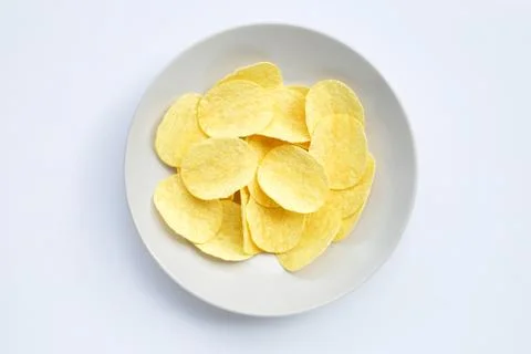 Potato chips on white background. Stock Photos