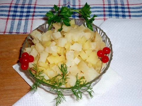 Potato cubes on a plate Foto stock
