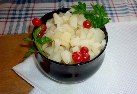 Potato cubes on a plate Foto stock