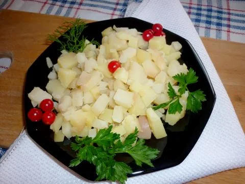 Potato cubes on a plate Stock Photos