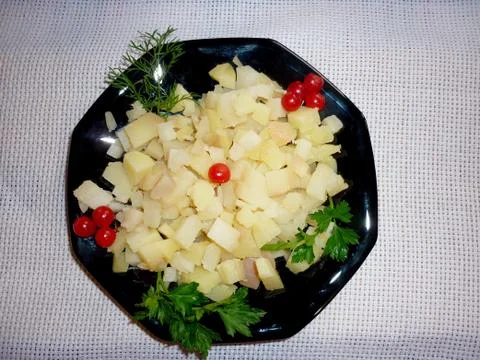 Potato cubes on a plate Stock Photos