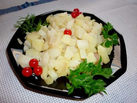 Potato cubes on a plate Foto stock