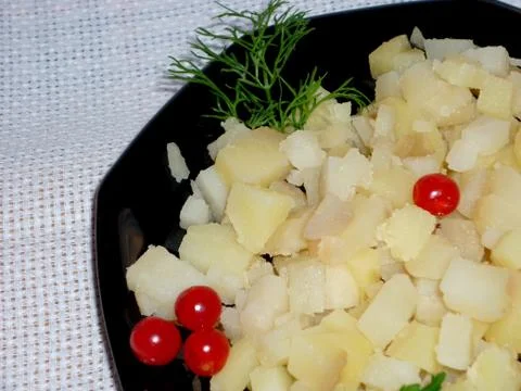 Potato cubes on a plate Stock Photos