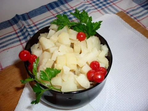 Potato cubes on a plate Stock Photos