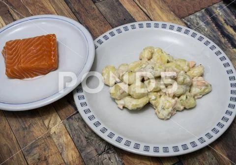 Potato dumplings with salmon and cream Stock Photos
