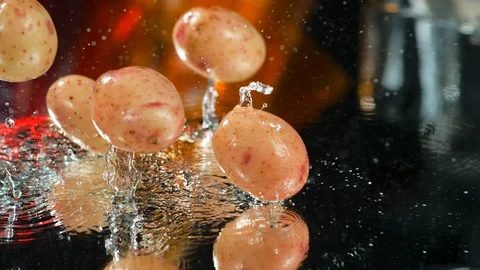 Potato falls on a table with water in slow motion,4k,high speed camera Stock Footage 114969976