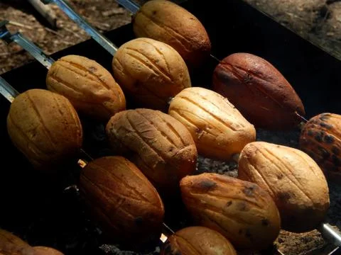 Potato on the grill Stock Photos