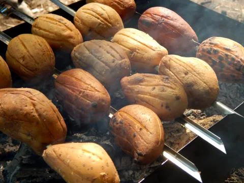 Potato on the grill Stock Photos