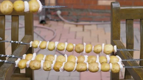A potato kebab with lard for the preparing it for frying on the grill. Man Stock Footage 223223506