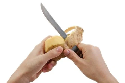 Potato knife peeling Stock Photos