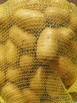 Potato mesh bag Stock Photos