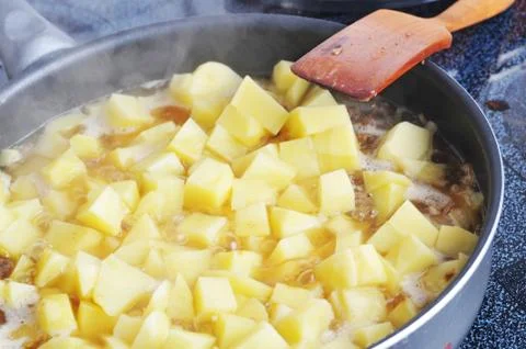 Potato in pan Stock Photos