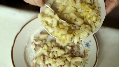Potato. Preparation of a dish herring under a fur coat. Stock Footage 70269381