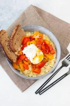 Potato risotto with grilled red pepper, poached egg and warm bread Stock Photos