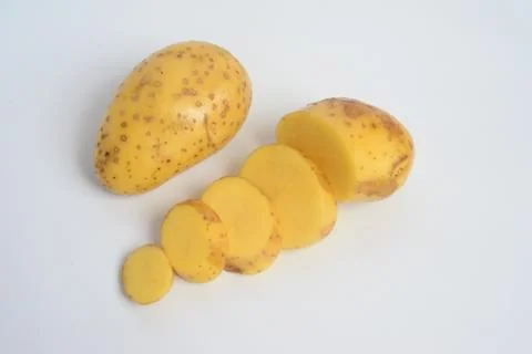 The potato is a root vegetable native to the Americas Stock Photos