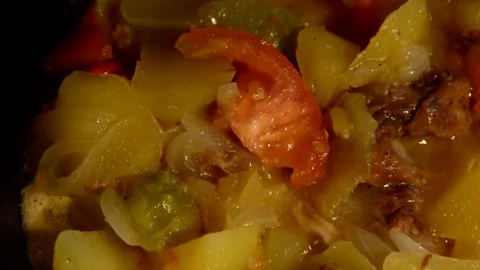 Potato with sliced bell pepper, tomato and meat stew Stock Footage 259229916