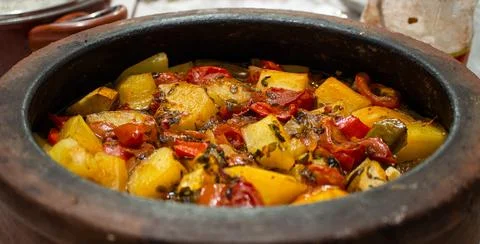 Potato stew in earthenware pot Stock Photos