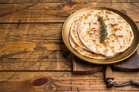 Potato Stuffed Flat Bread Aloo paratha, Traditional Indian food. wooden bac.. Stock Photos