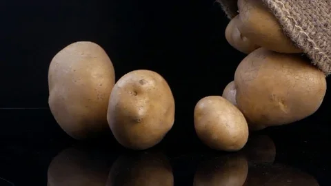 Potato vegetable isolated on black background Video stock 121782758