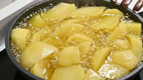 Potatoes to add to a stew. closeup frying Stock Footage 217983943