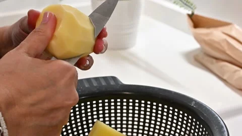 Potatoes to add to a stew. Costing them Stock Footage 217983891
