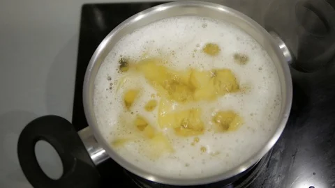 Potatoes are cooked in a pot Stock Footage 98135133