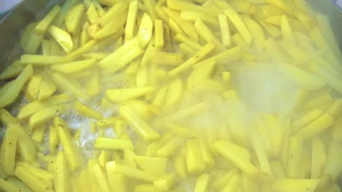 Potatoes are fried on a disk in nature 스톡 동영상 241743976