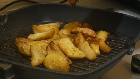 Potatoes are fried in a frying pan. Cooking french fries, boiling in oil. Stock Footage 101364892