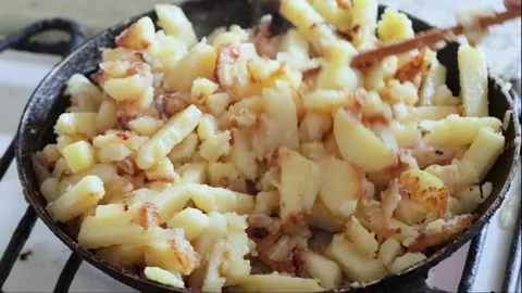 Potatoes are fried in a pan 2 Stock Footage 249174225